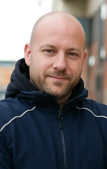 Das Bild zeigt den Geschäftsführer Daniel Olbrich